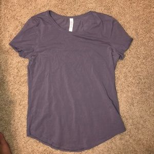 Purple lululemon tee.